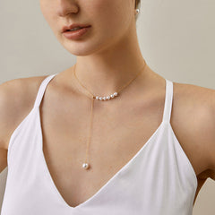 Fine Gold Necklace Featuring Asymmetrical Arrangement of Ocean Pearls
