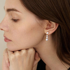 Handcrafted 14K Gold Earrings with Natural Pearl Cascade Design